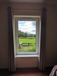 View out of bedroom window across countryside at Carnaclasha, no. 9, Rostrevor Holidays