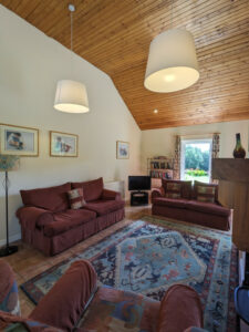 Sitting room area, with two sofas and armchair, and large rug, Carnaclasha, no. 9, Rostrevor Holidays